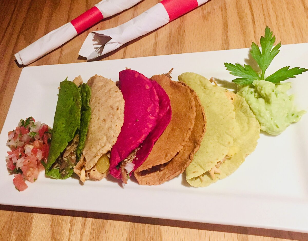 Beautifully plated taco meal with authentic Mexican sides