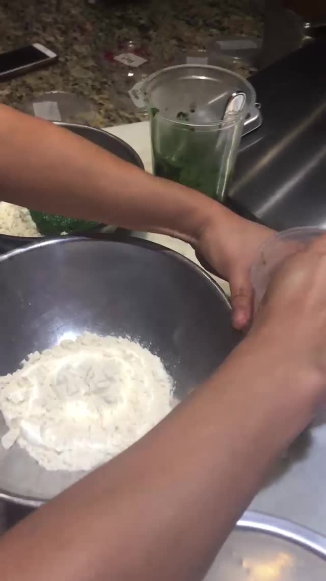 Video still of the kitchen team cooking together