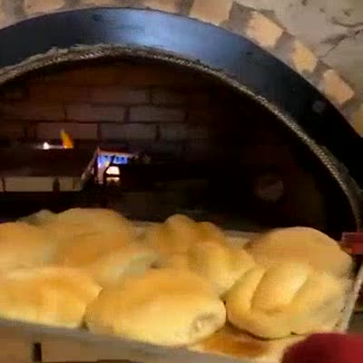 Bread baking inside the hand-built horno
